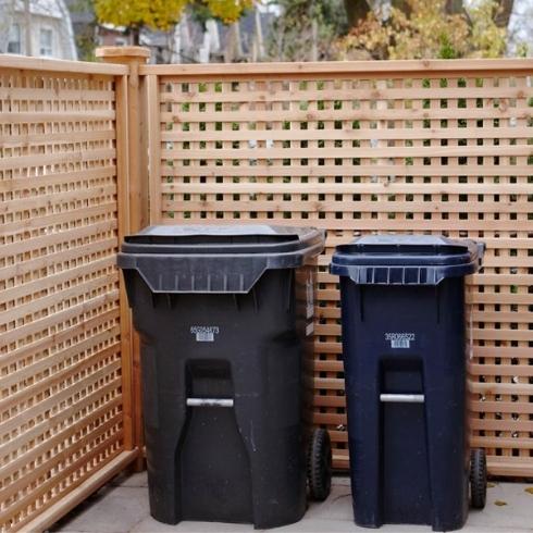 A garbage bin and recycling bin