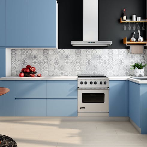 Blue kitchen with grey backsplash