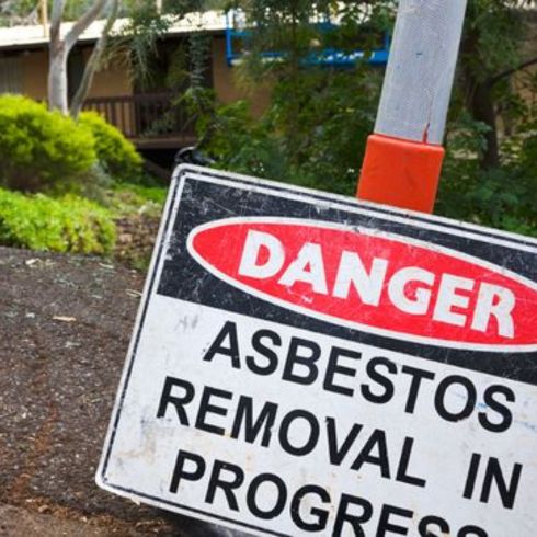 Asbestos warning sign on home