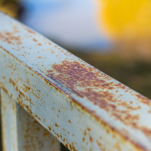 A rusty painted railing