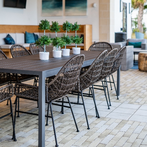 An outdoor dining set with table and chairs