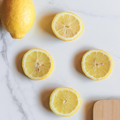 sliced lemons on a white counter