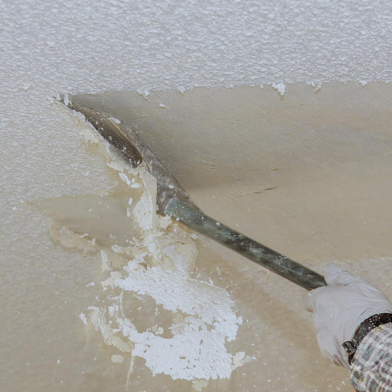 Take off in the popcorn ceiling home wall texture removal - stock photo