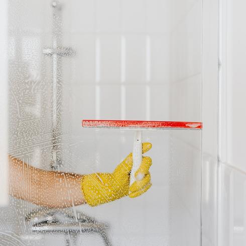 Person cleaning their shower