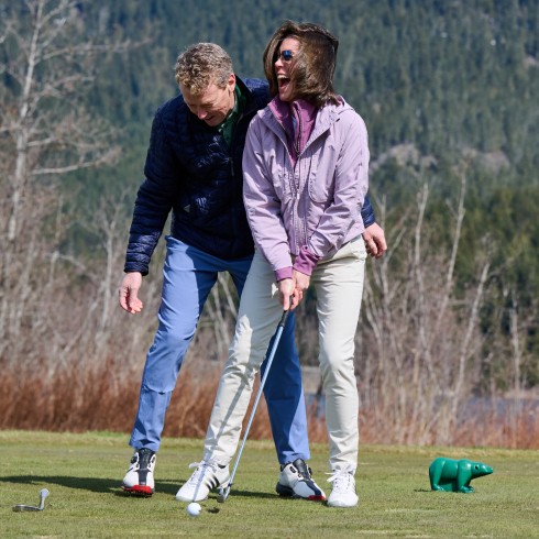 Sarah Richardson and husband golfing
