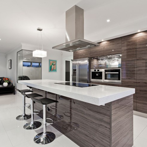sleek modern kitchen with glossy wood cabinets