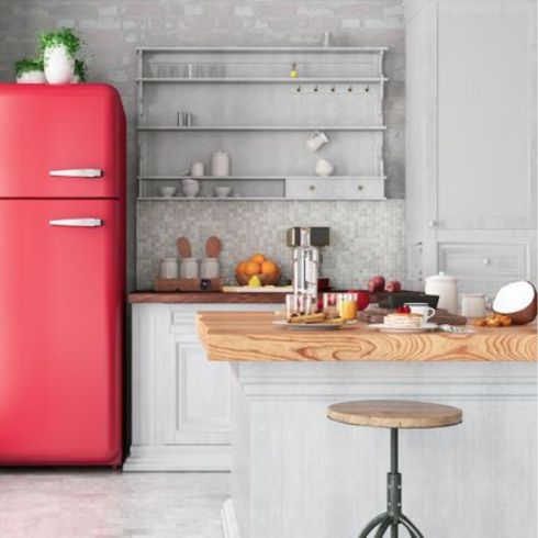 grey loft apartment kitchen with red fridge