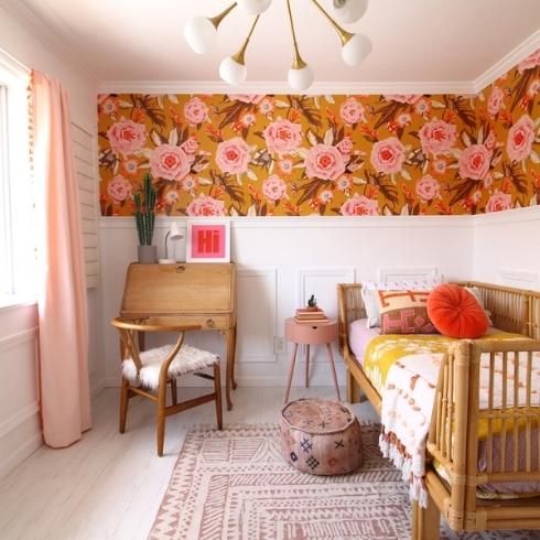 Kids' boho-style bedroom with floral wallpaper