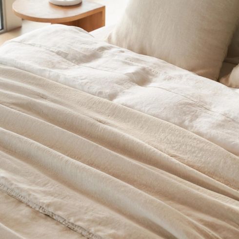 Earthy beige layered linen bedding