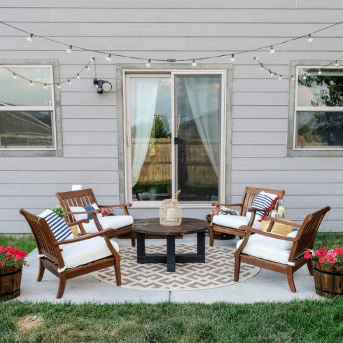 An outdoor patio with string lights