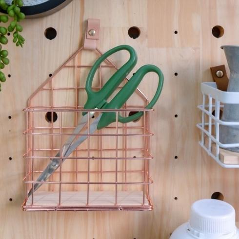 Pegboard with accessories and faux plant