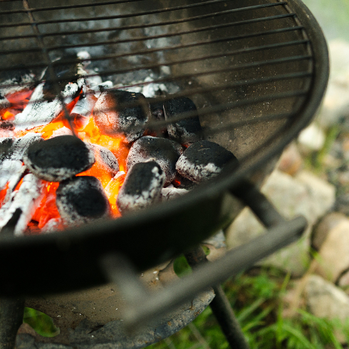An open charcoal grill