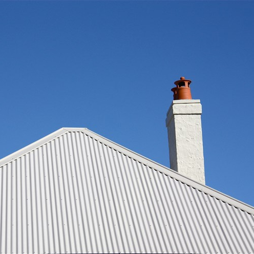 A light grey metal roof on a bright day