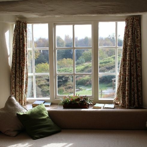 A large window looking out to a beautiful landscape