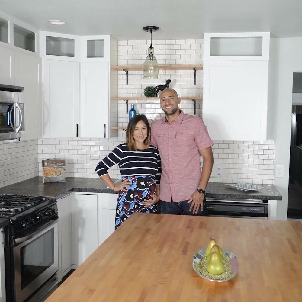 Chenoa and David Rivera in a newly renovated kitchen as part of Rustic Rehab