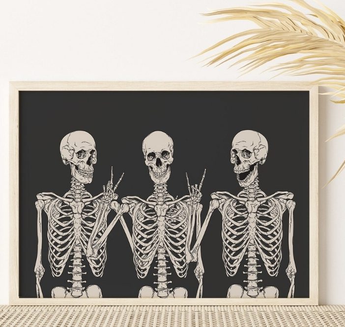 Three skeletons holding peace signs in a framed print