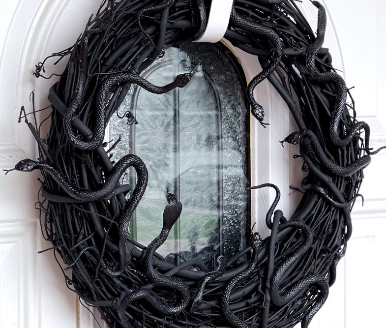 Black snake wreath on a white door