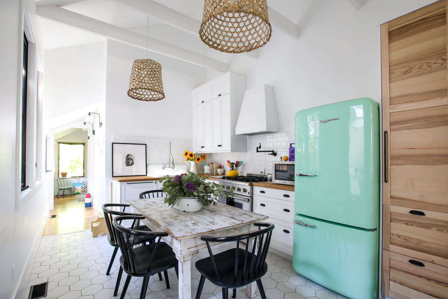 Vintage mint green fridge in modern white kitchen