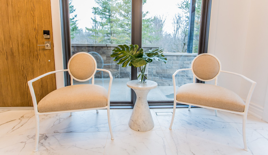 Statement chairs in a modern entryway.