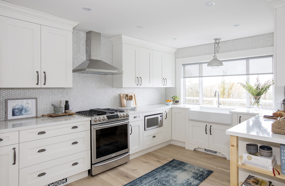 Modern white kitchen with penny-tile backsplash.