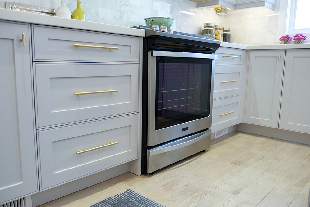 White lower drawers and a new high end oven feature in this chic modern kitchen