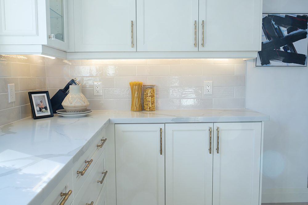 Chic white modern kitchen cabinets with gold handles