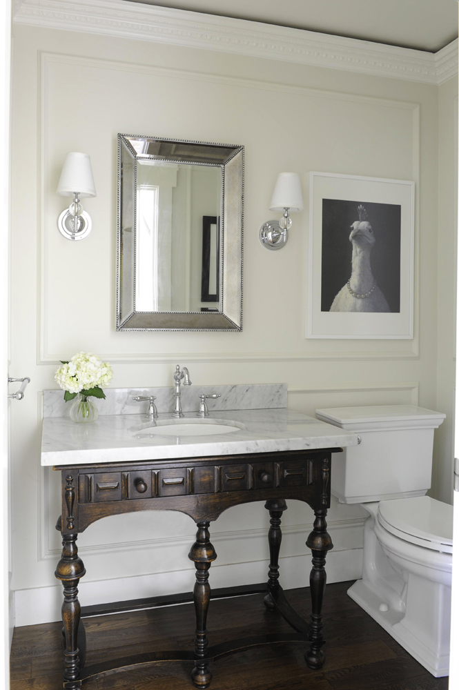 Carmel extended the bathroom's vintage look into her powder room