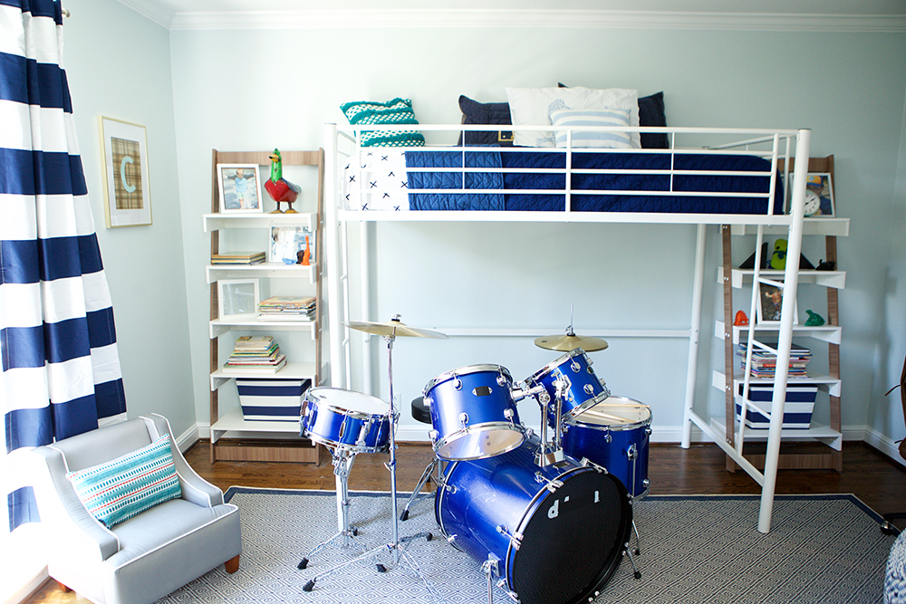 Blue and white kids' room with smart storage elements.