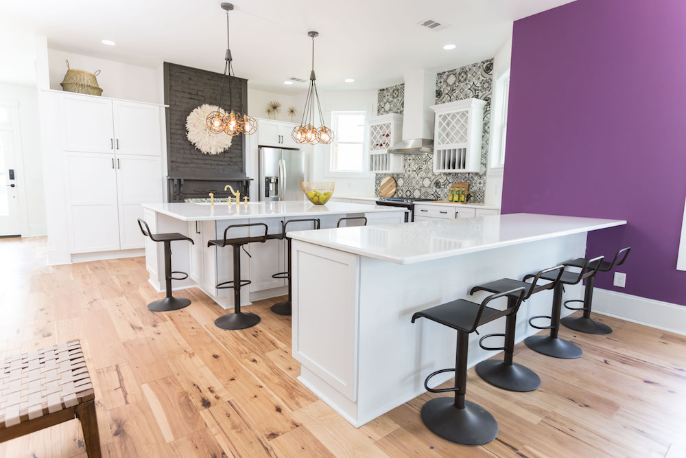 Masters of Flip bohemian Victorian house kitchen island and peninsula with white countertops and purple feature wall