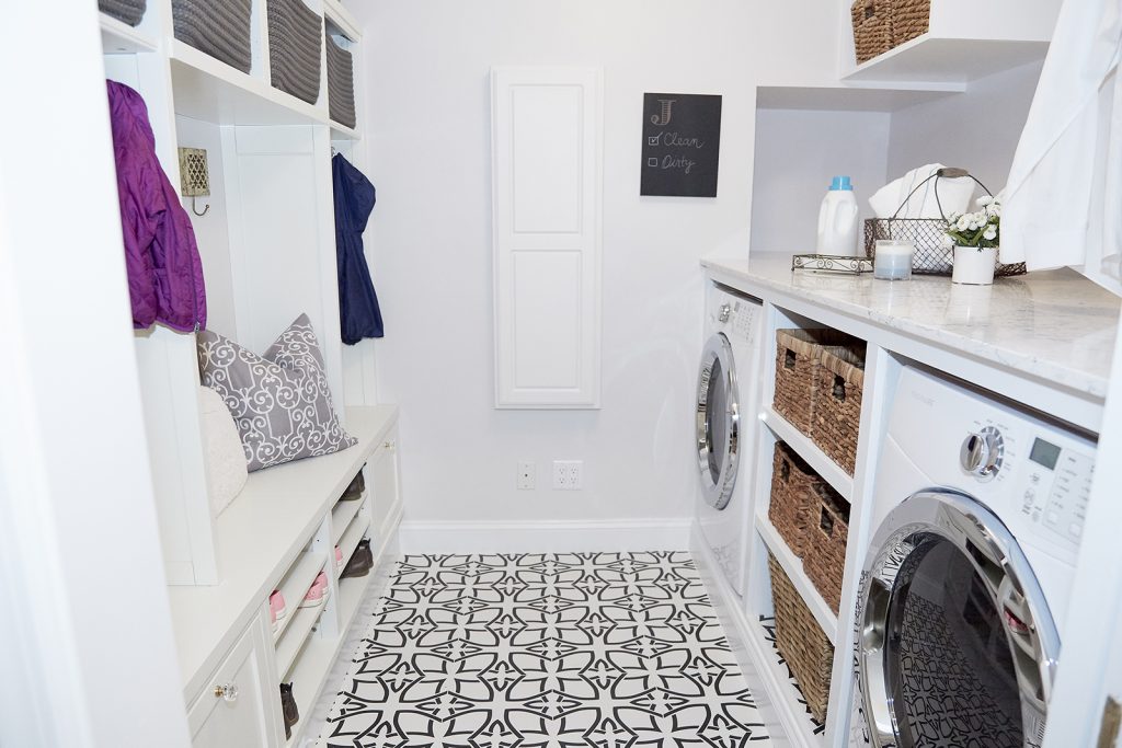 Laundry room with geometric floor and wicker baskets