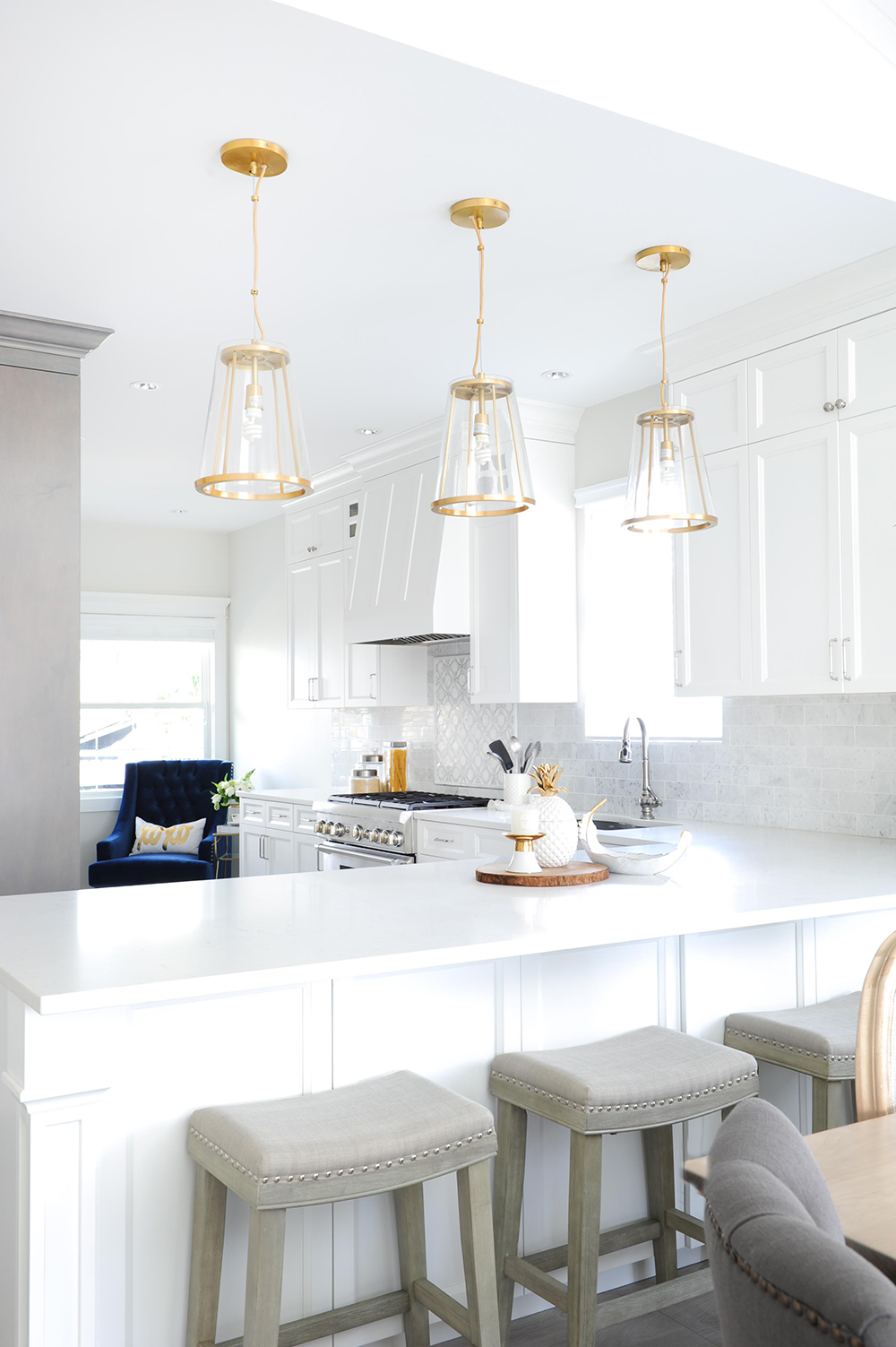 Modern white kitchen with glam gold accents