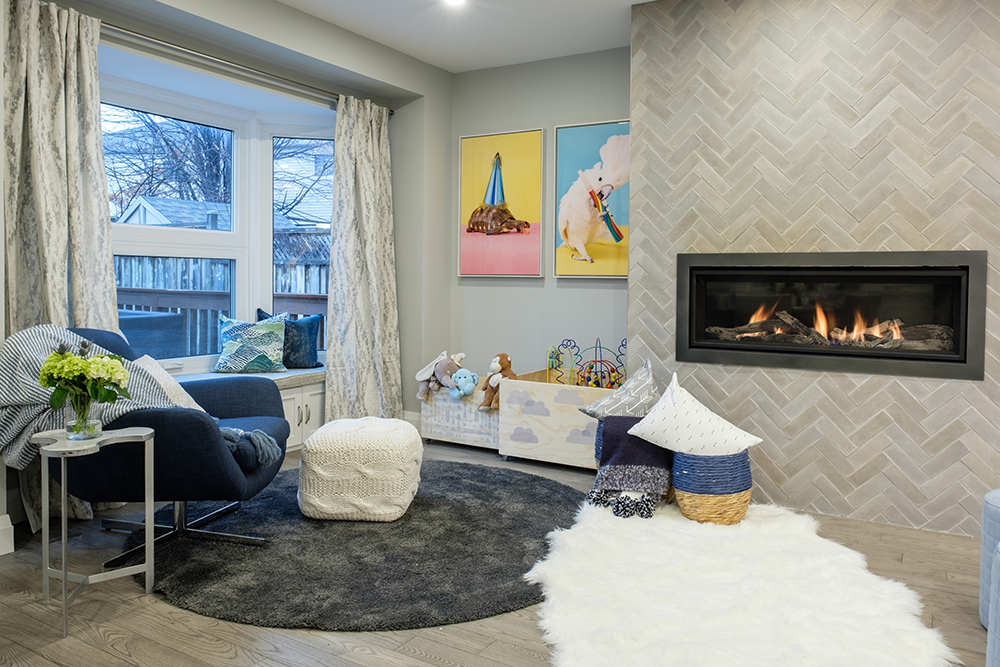 Chic children's play area in a modern living room with linear gas fireplace