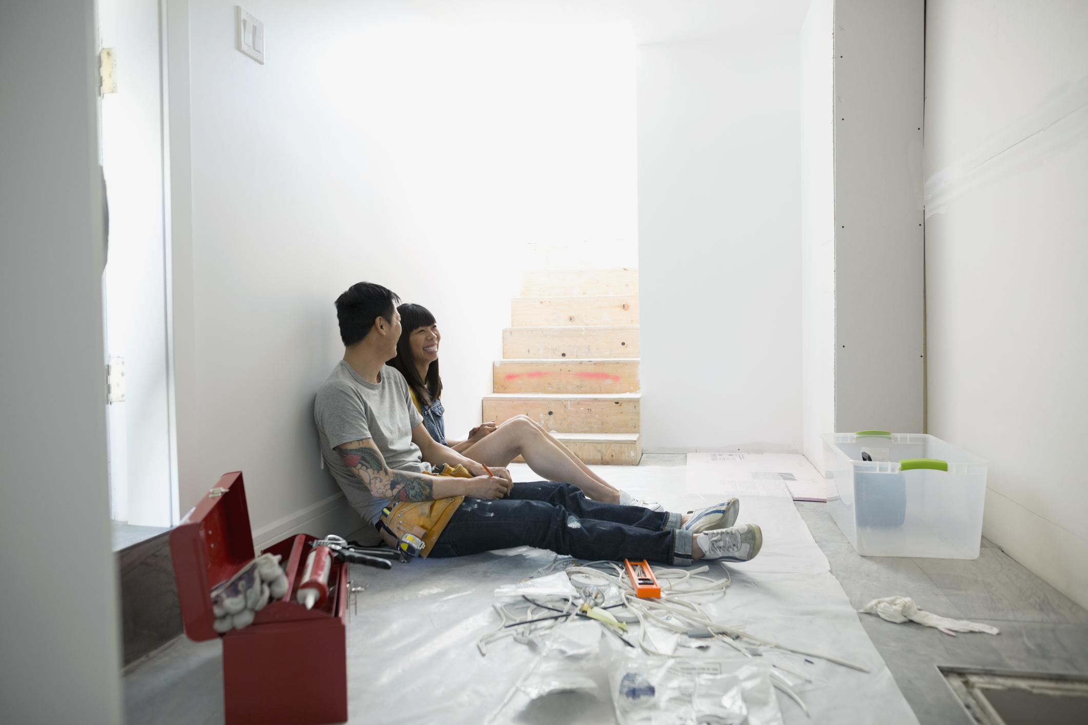 Couple taking a break from home improvement project