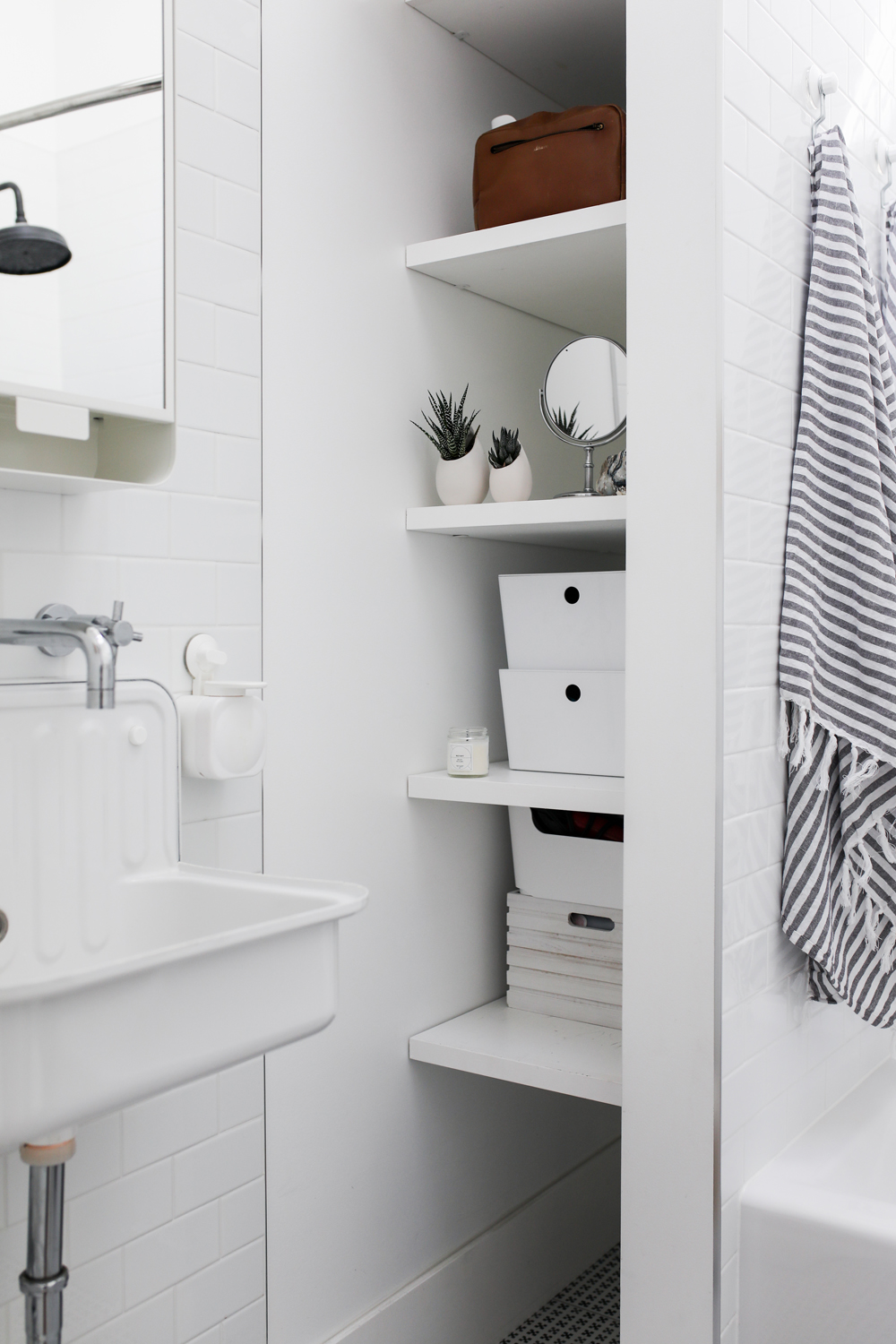 White Bathroom shelves with succulents and Turkish towels