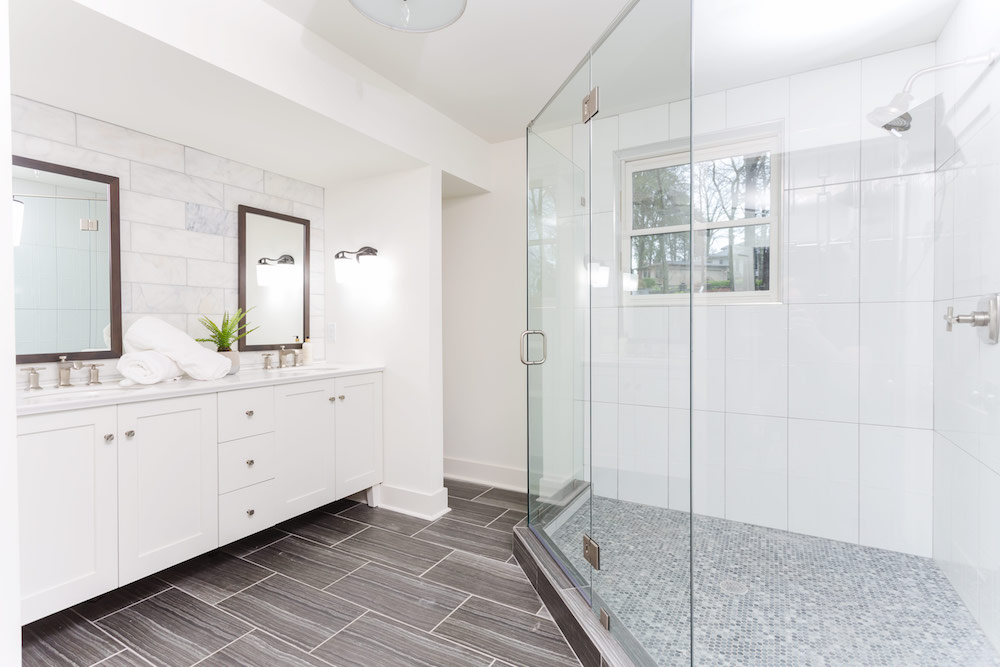 Masters of Flip split level master ensuite with enormous tiled shower and double sink white vanity