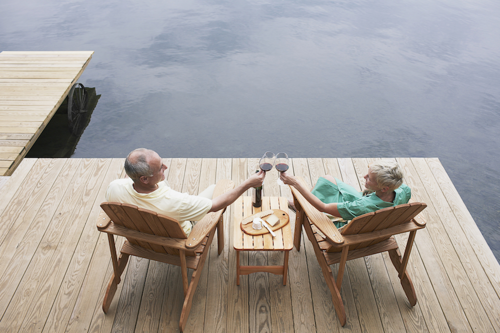 Couple drinking wine outdoors on a dock