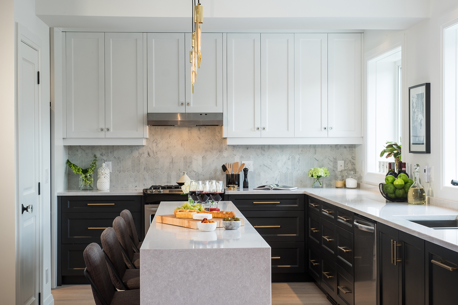 Modern kitchen with white upper cabinetry and black lower cabinets.
