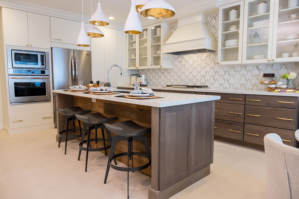 Modern gold, white and wood kitchen design.
