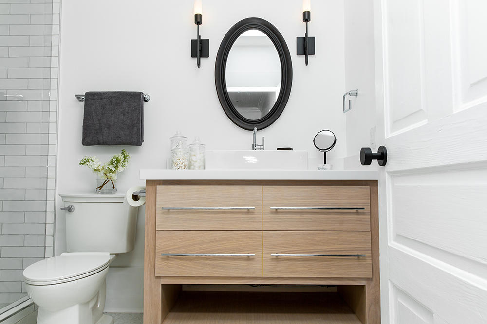 A white and black master bathroom.