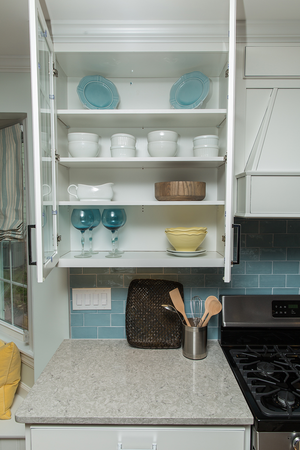 With only a couple of upper display cabinets, most of the everyday kitchen storage space is below in the lowers.