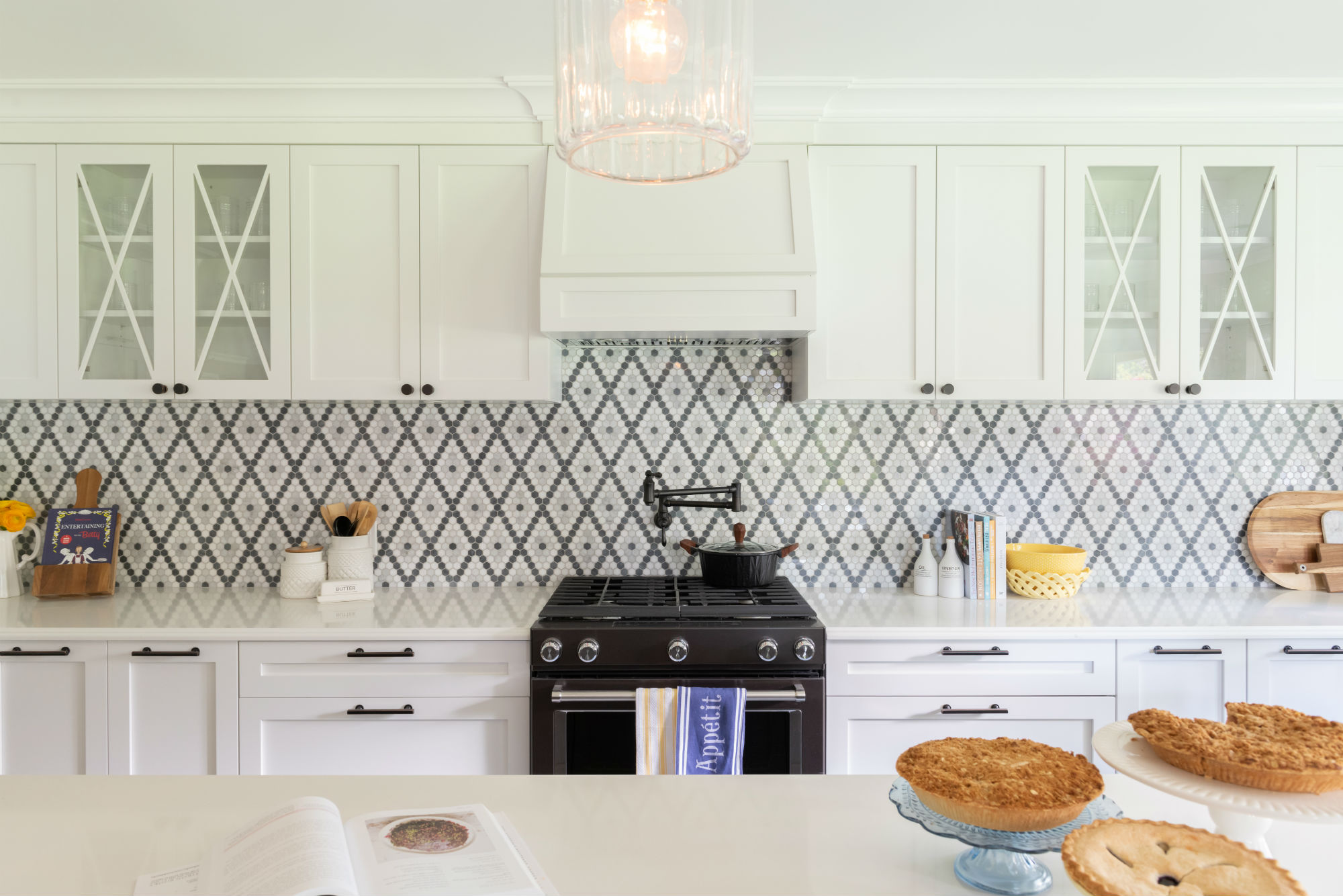 Kitchen with intricate diamond design penny tile backsplash