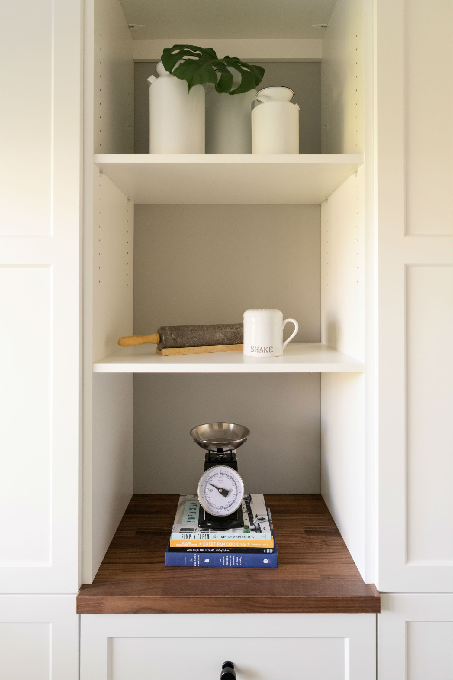 Pantry shelf with cookbooks and decor