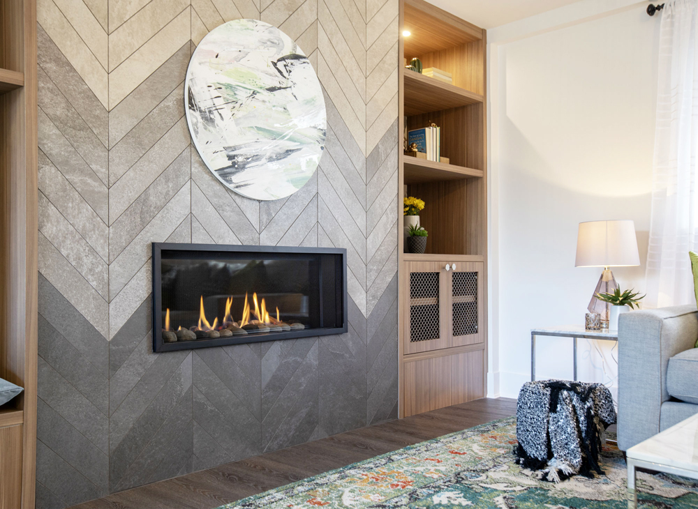 A full-length herringbone gas fireplace in a spacious living room