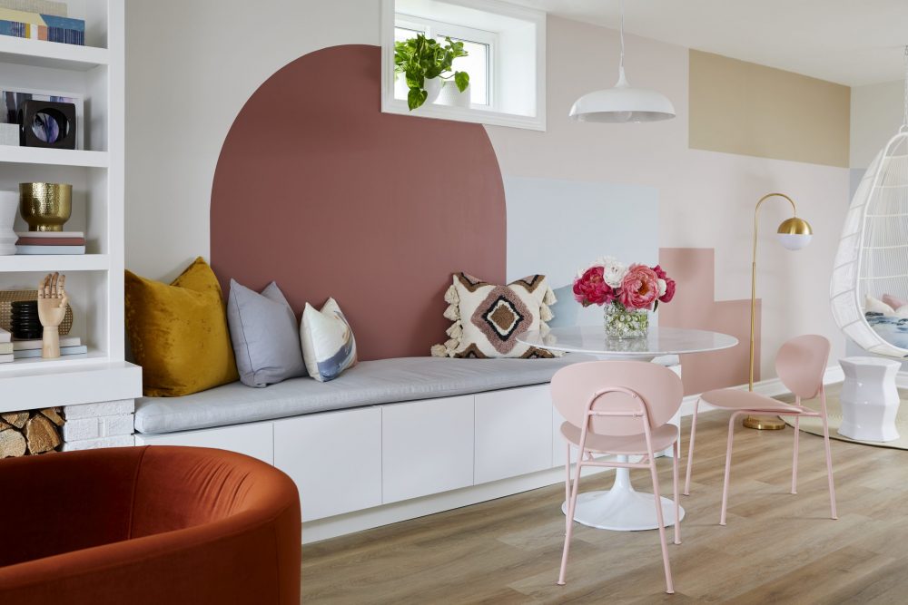 spacious breakfast nook with bench seating and colour-blocked wall