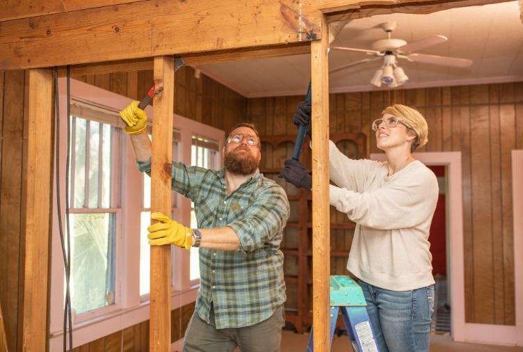 Ben and Erin Napier working on a home renovation