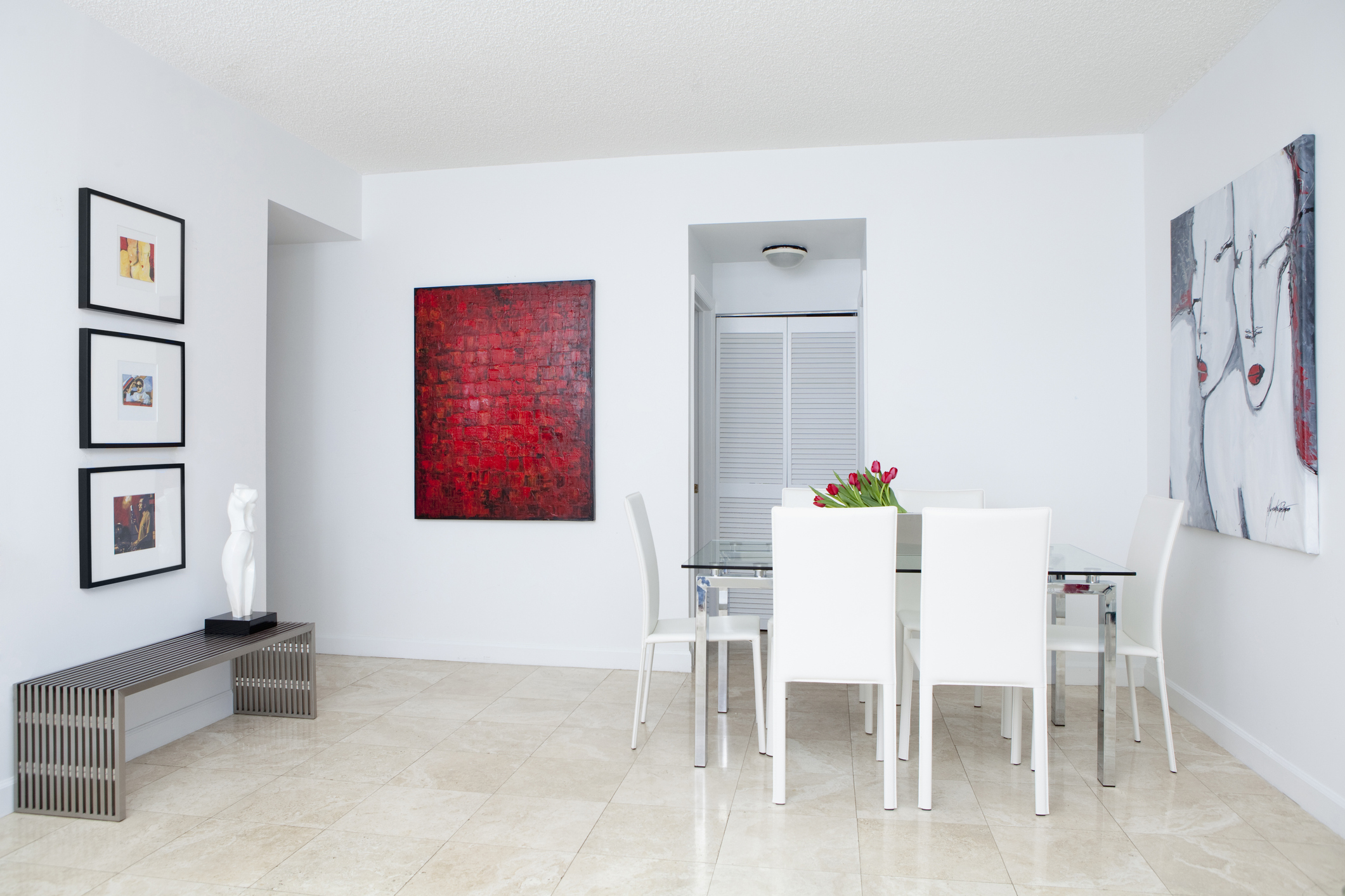 Wall art, table and chairs in modern dining room