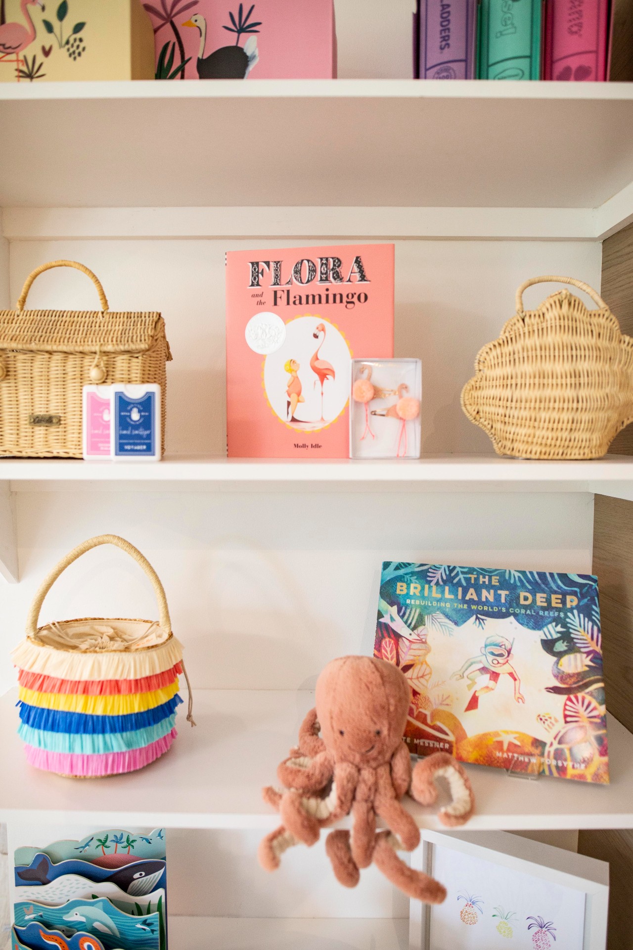 Boutique shelf with colourful books and accessories