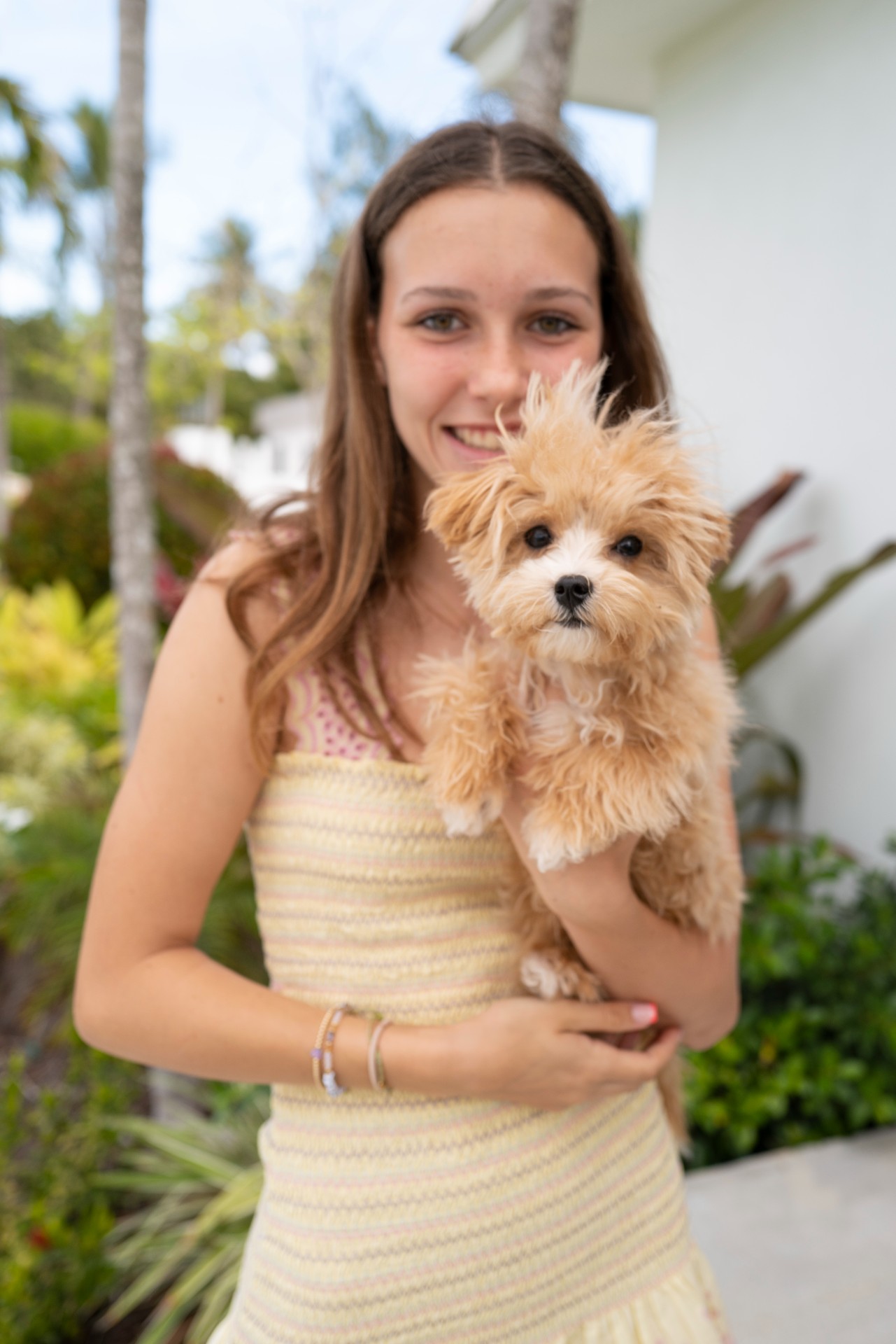 Charlotte Baeumler smiling with small dog