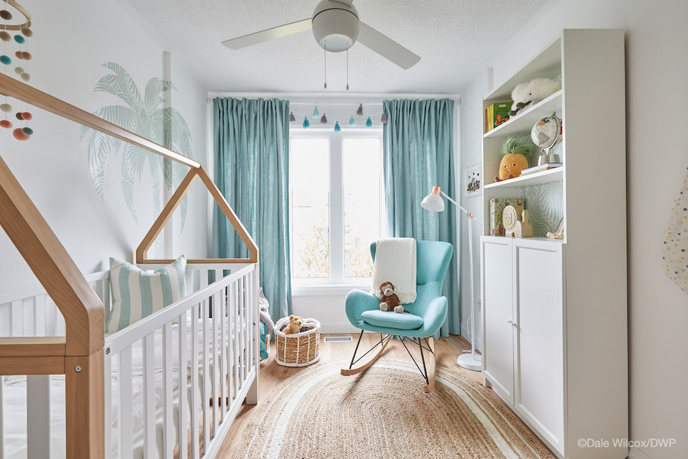 white and blue nursery with turquoise curtains and a white crib