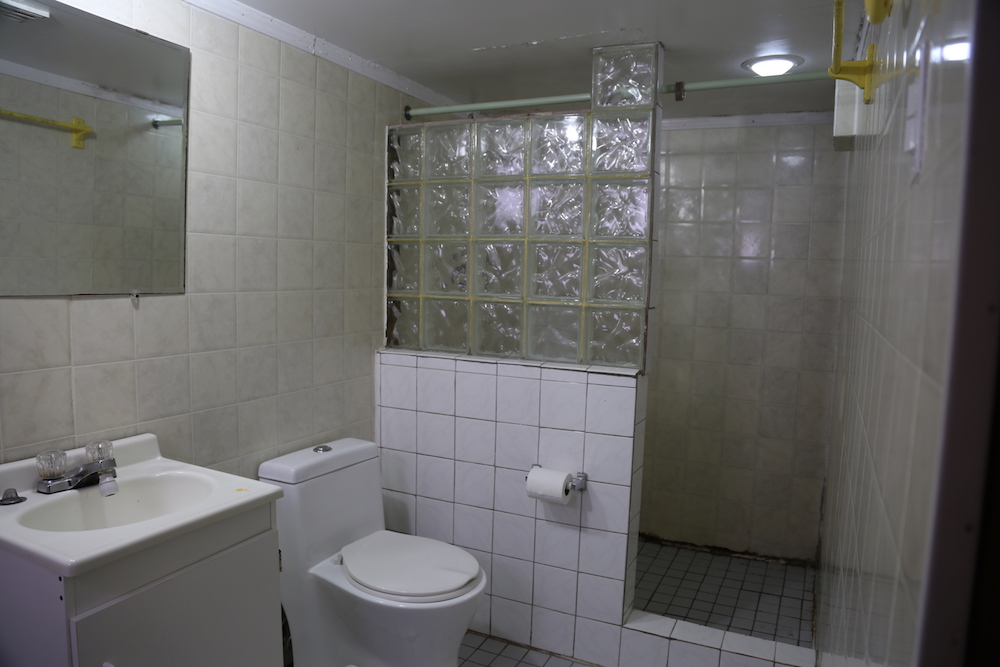white bathroom with glass tiles